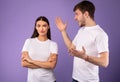 Young man arguing with his girlfriend who ignoring him Royalty Free Stock Photo