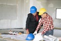 Young man asian engineers were consulted together and plan in construction site Royalty Free Stock Photo