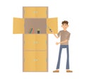 Young man assembling a cupboard. Man standing in front of a closet with a screwdriver in his hand. Colorful flat vector