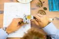 young man assembling mechanical watch. watch production. mans hands Royalty Free Stock Photo