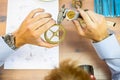 young man assembling mechanical watch. watch production. mans hands Royalty Free Stock Photo