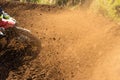 A young man, a man, an athlete, driving a motocross motorcycle in the blur, on a dirt track. Movement, blur, slow-motion Royalty Free Stock Photo