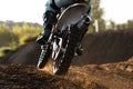 A young man, a man, an athlete, driving a motocross motorcycle in the blur, on a dirt track. Movement, blur, slow-motion Royalty Free Stock Photo