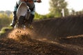 A young man, a man, an athlete, driving a motocross motorcycle in the blur, on a dirt track. Movement, blur, slow-motion Royalty Free Stock Photo