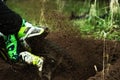 A young man, a man, an athlete, driving a motocross motorcycle in the blur, on a dirt track. Movement, slow-motion Royalty Free Stock Photo