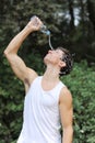 Young man athlete refresh himself Royalty Free Stock Photo