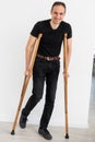 Young man with axillary crutches