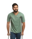 Young man with axillary crutches on white background