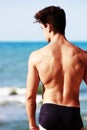 Young man from the back looking at the sea Royalty Free Stock Photo