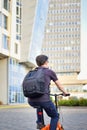 Young man with backpack, cyclist on a bicycle while biking around the city