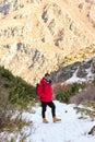 Young man with backpack see view on top mountain. Freedom, happiness, travel and vacations concept, outdoor activities Royalty Free Stock Photo