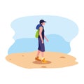 young man with backpack walking sand