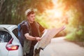 Young man backpacker travelling and photographer with car Royalty Free Stock Photo