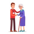 Young man with badge helping an old lady