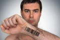 Man with barcode on his hand - genetic clone concept