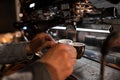 Young man barista making espresso in a coffee machine. Male hands hold black cups. Coffee break. Royalty Free Stock Photo