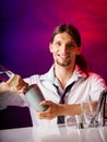Young man bartender preparing alcohol cocktail drink