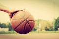 Young man on basketball court. Dribbling with ball