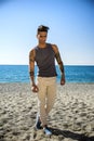 Young Man at Beach in Sunny Summer Day Royalty Free Stock Photo