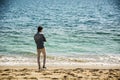 Young Man at Beach in Sunny Summer Day Royalty Free Stock Photo