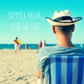 A young man on the beach and the text summer break, here we go Royalty Free Stock Photo