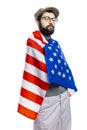 A young man with a beard and a cap with an American flag. Isolated on a white background. Independence Day. Vertical Royalty Free Stock Photo