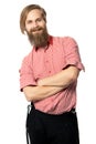 The young man with a beard of the European appearance smiles on a white background in a red shirt and black trousers with braces Royalty Free Stock Photo