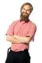 The young man with a beard of the European appearance smiles on a white background in a red shirt and black trousers with braces Royalty Free Stock Photo