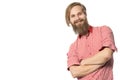 The young man with a beard of the European appearance smiles on a white background in a red shirt and black trousers with braces Royalty Free Stock Photo