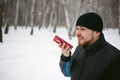 Young man with a beard outdoors in the snow in the winter Royalty Free Stock Photo