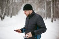 Young man with a beard outdoors in the snow in the winter Royalty Free Stock Photo