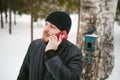 Young man with a beard outdoors in the snow in the winter Royalty Free Stock Photo