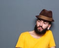 Young man with beard and piercings wearing hat Royalty Free Stock Photo