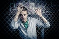 A young man behind bars close Royalty Free Stock Photo