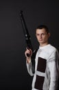 Young man with big gun Royalty Free Stock Photo