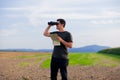 Young man with binoculars and map Royalty Free Stock Photo