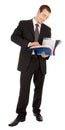 Young man in a black business suit with a folder i Royalty Free Stock Photo