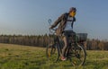 Young man on black electric bike in spring color evening Royalty Free Stock Photo