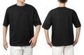 Young man in blank oversize t-shirt mockup front and back used as design template