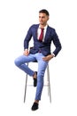 Young man in blue business jacket and jeans isolated