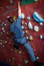 Young man climbing on wall