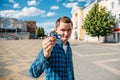 Young man in blue shirt shows Fidget Spinner, selective focus on Spinner with blurred background Royalty Free Stock Photo