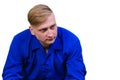 A young man in a blue shirt is thoughtful and looks away Royalty Free Stock Photo