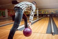 Young man at the bowling alley with the ball. Royalty Free Stock Photo