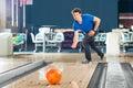 Young man bowling having fun