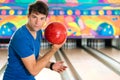 Young man bowling having fun