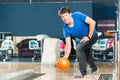 Young man bowling having fun