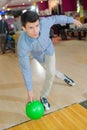 young man during bowling strike