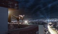 Young man boxing training , on top of the house above the city