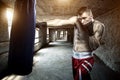 Young man boxing workout in an old building